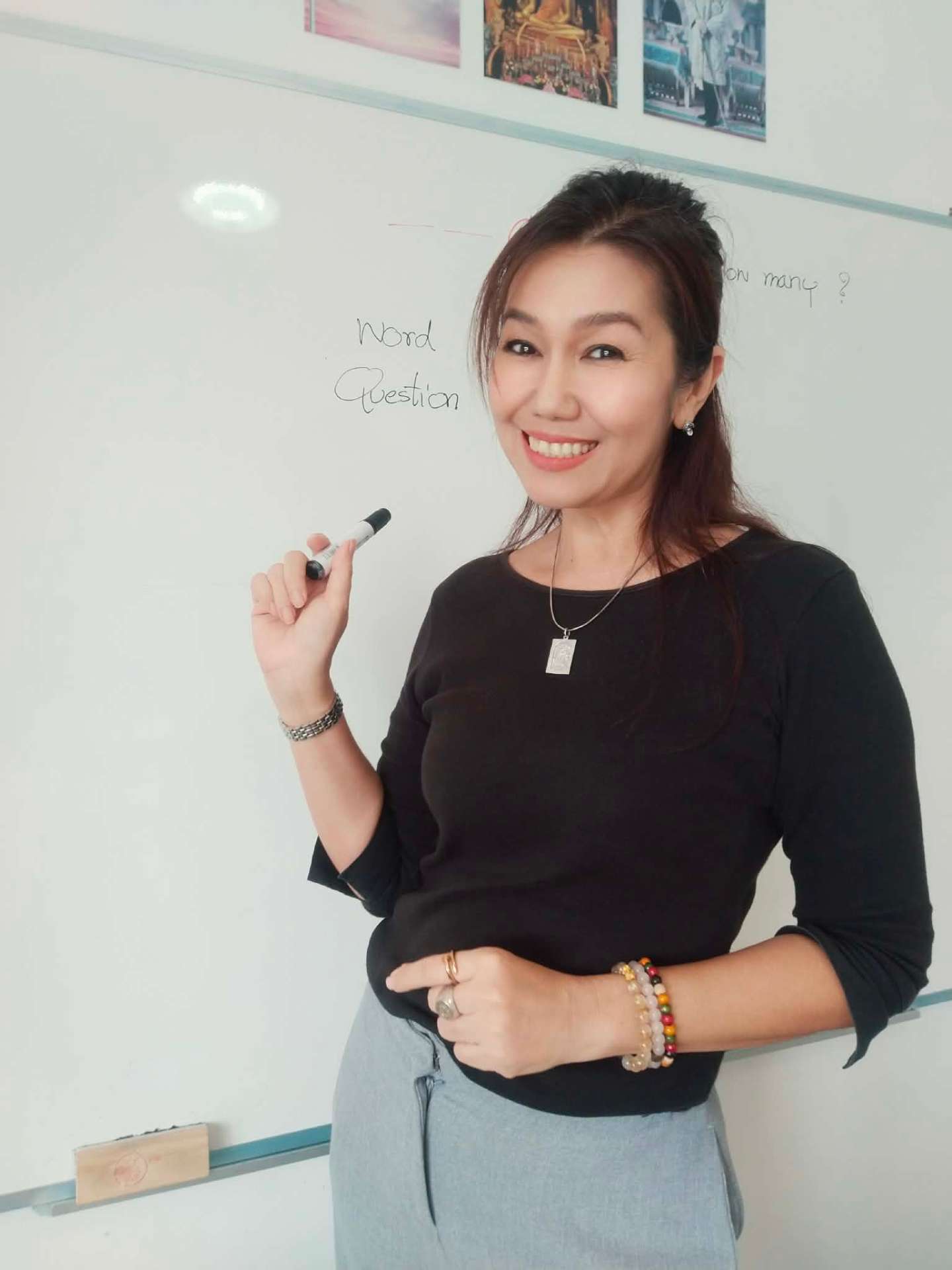 Rita teaching Thai at the whiteboard